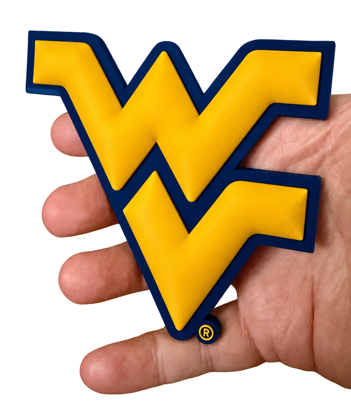 A Flying WV GeoMagnet held in a hand, showing its physical scale